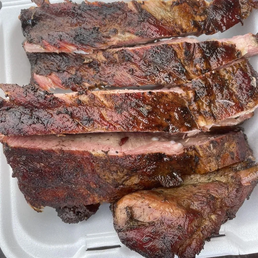 Close-up of smoked ribs with deep bark